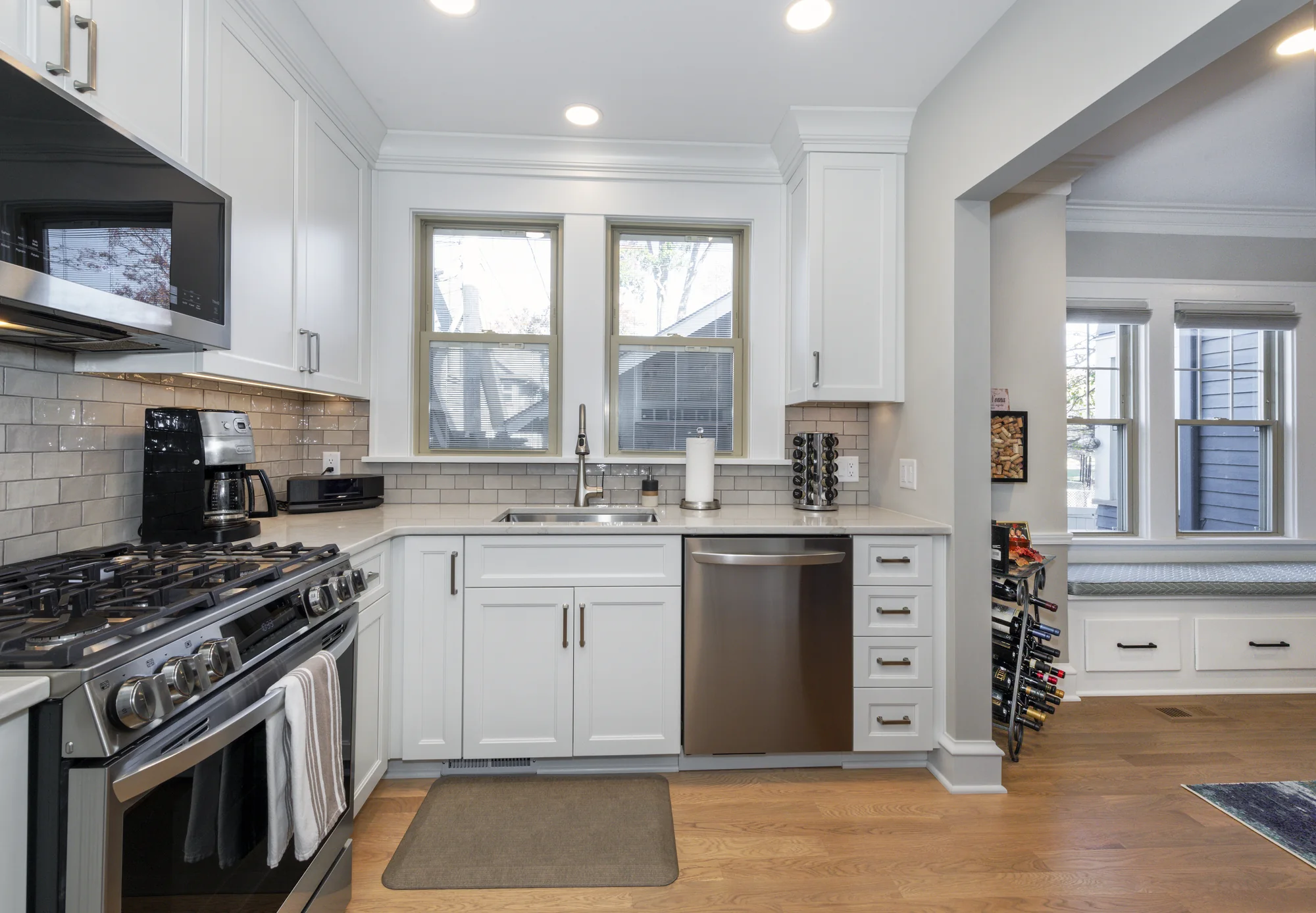 Range and sink walls framed by tall windows