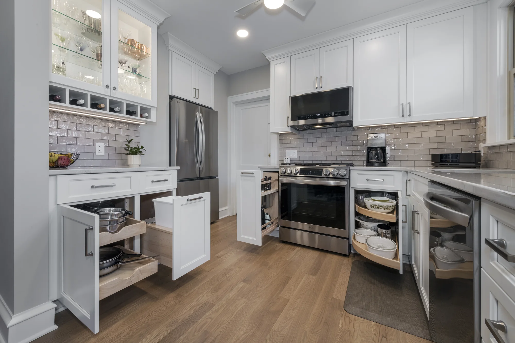Traditional white kitchen with its storage cabinets open